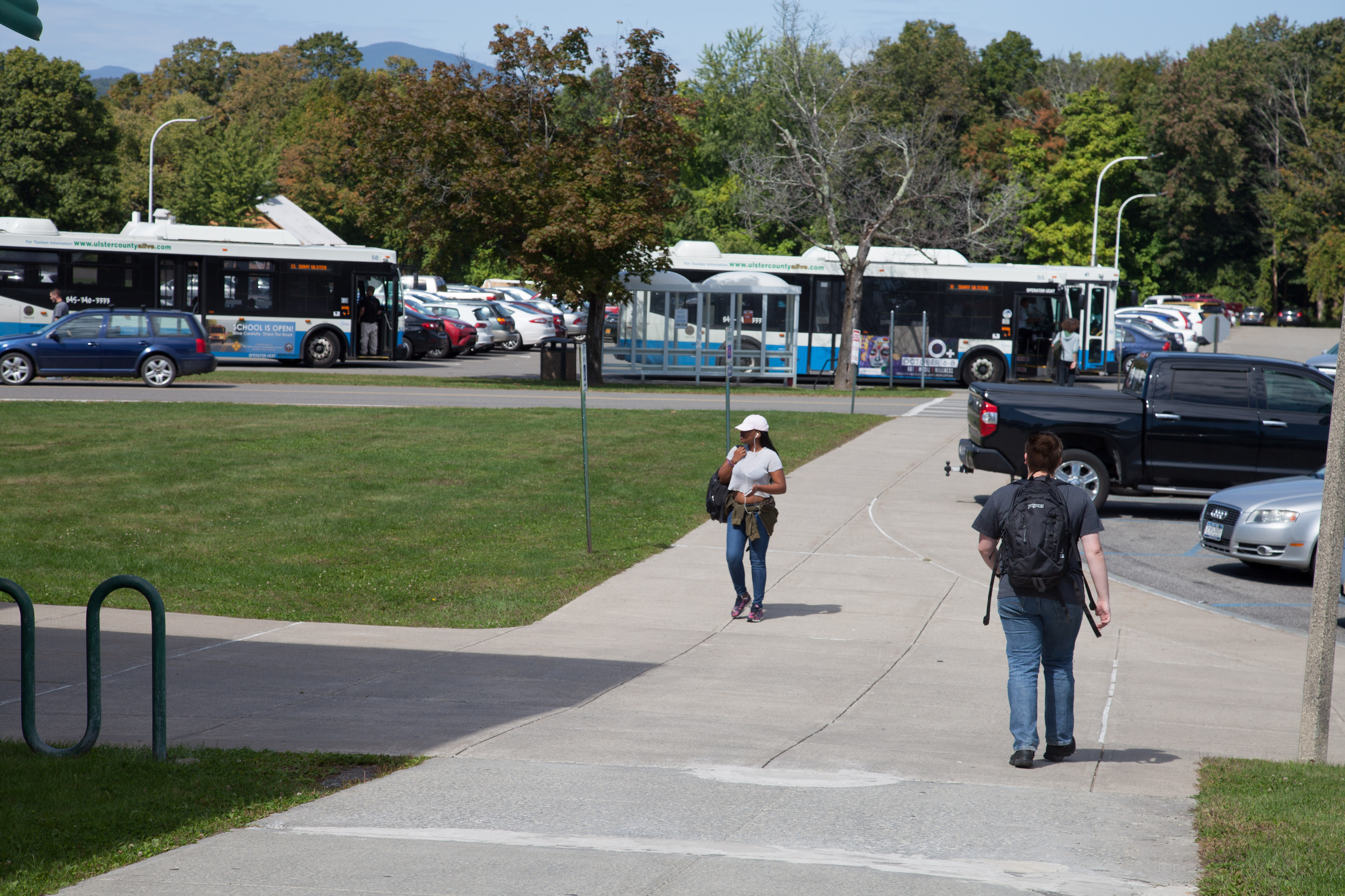 campus view with students and busses